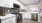 a newly renovated kitchen with granite countertops