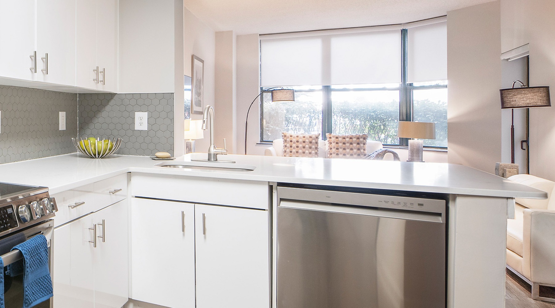 a kitchen with white countertops