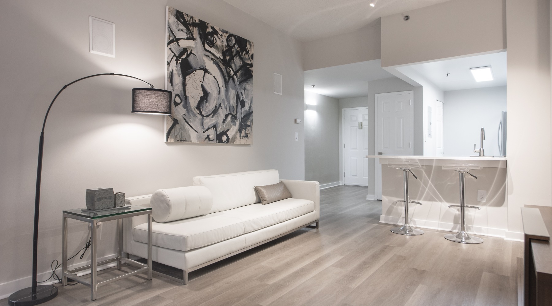 Spacious, well-lit kitchen and living area with a large couch