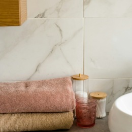 towels folded next to tolietry items