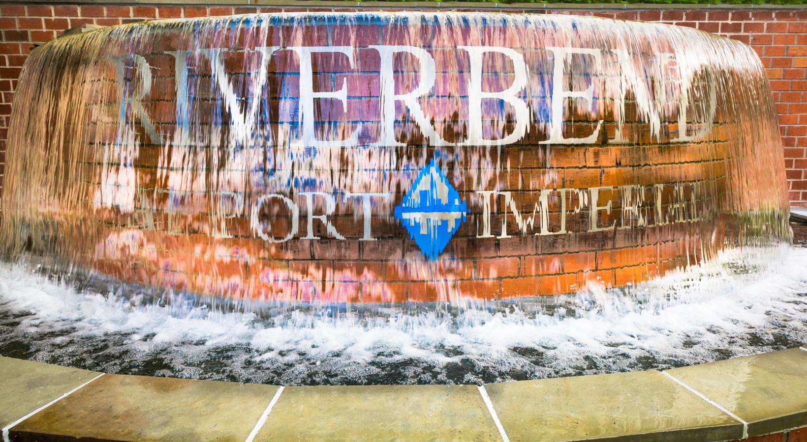 Find your perfect fit at Riverbend at Port Imperial a sign on a brick wall