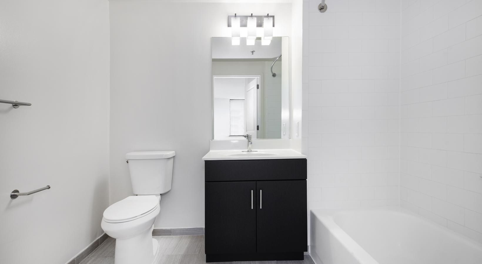 Bathroom options with thoughtful details a bathroom with a tub toilet and sink