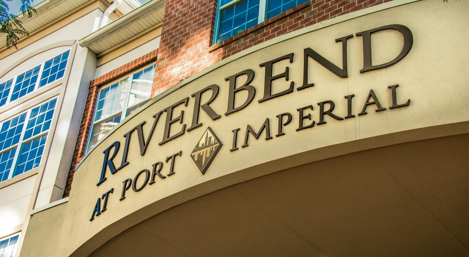 Find your perfect fit at Riverbend at Port Imperial a sign on the side of a building