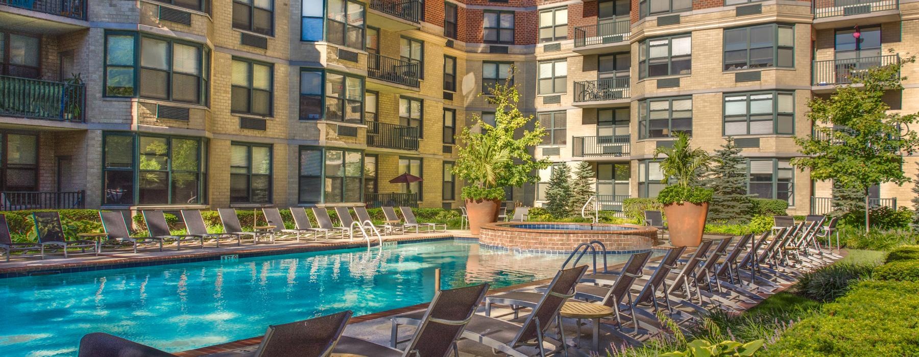 a pool with chairs around it