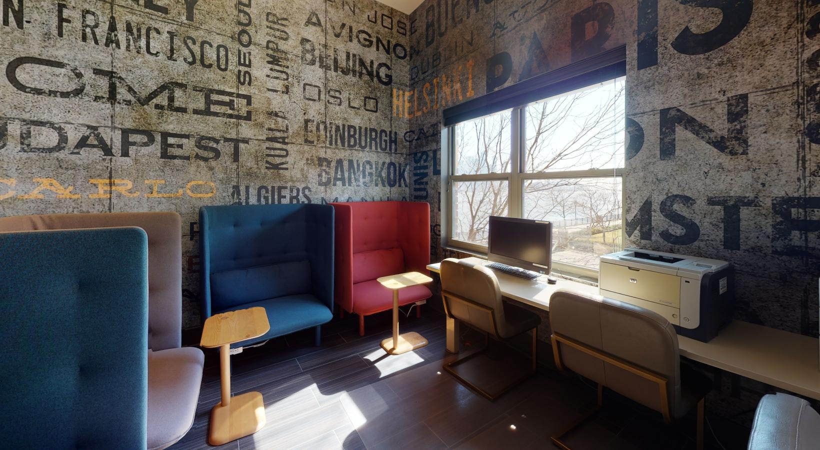 Everything within reach a room with a desk and chairs