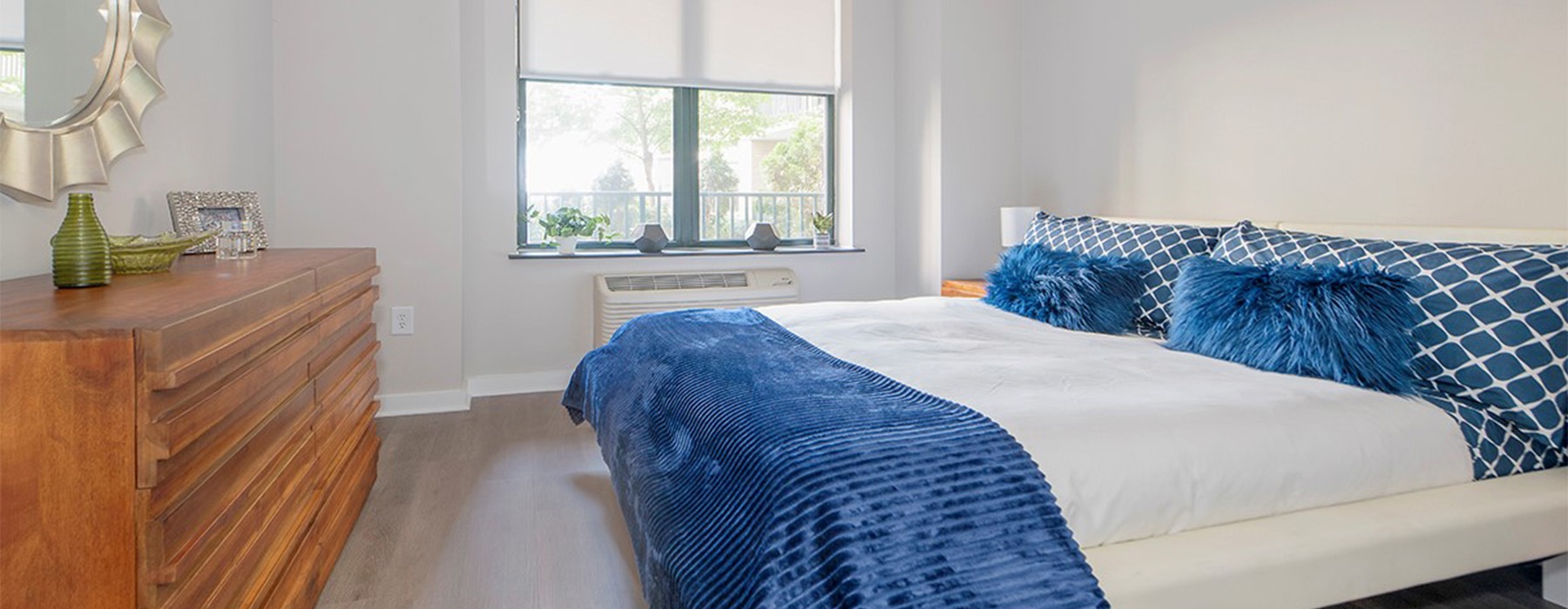 a bedroom with a large window