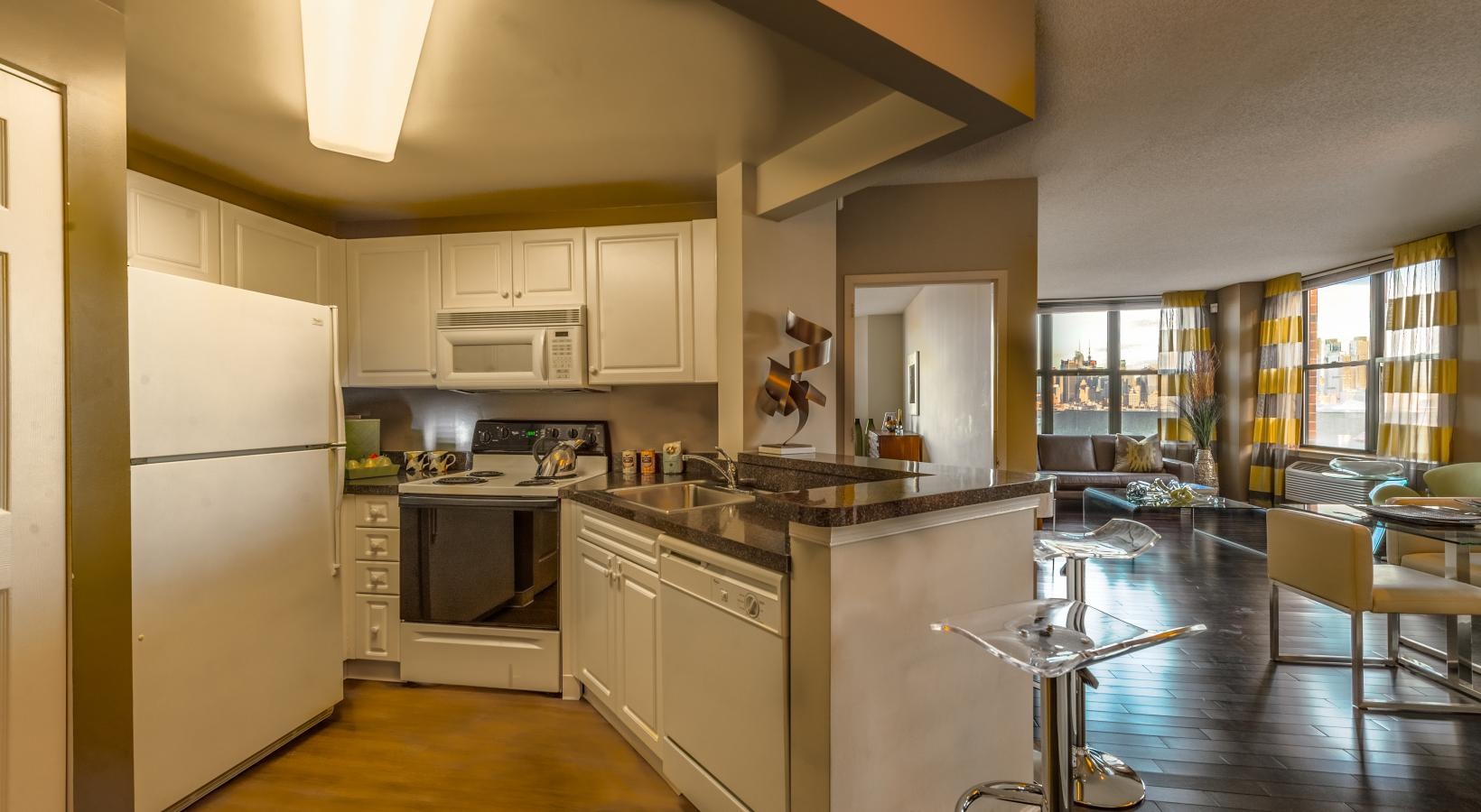 Spacious kitchens with thoughtful details a kitchen with white cabinets