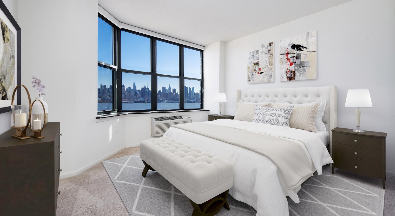 Relax and recharge in beautiful and spacious bedrooms a bedroom with a large window