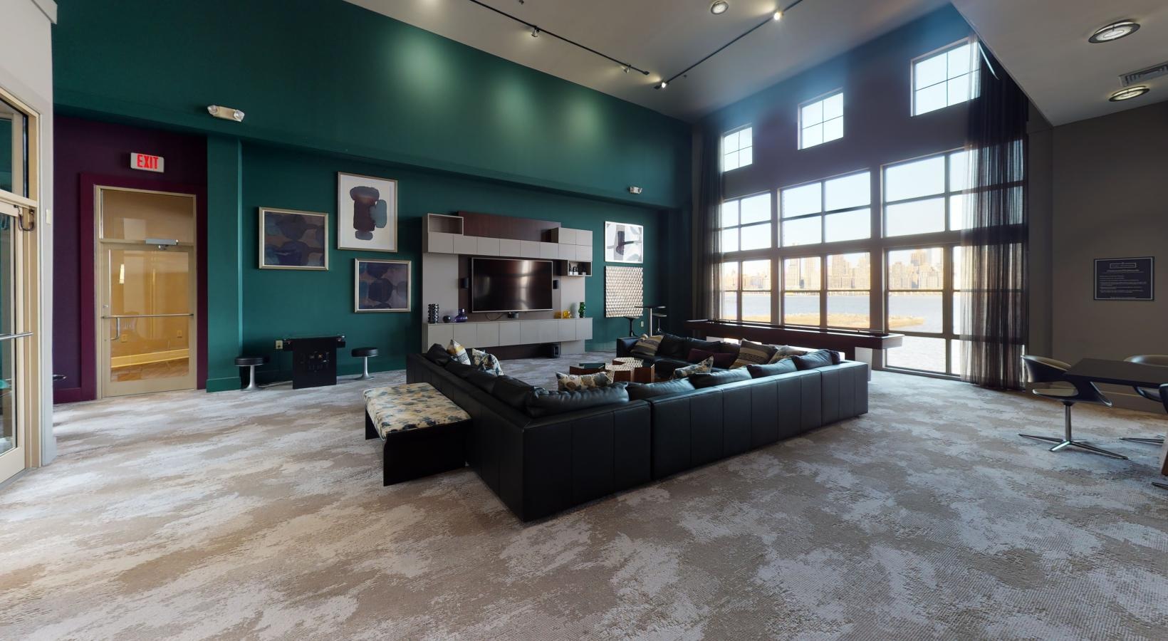 Take advantage of all Riverbend at Port Imperial has to offer a room with a couch and a table