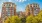 a tall building with trees in front of it