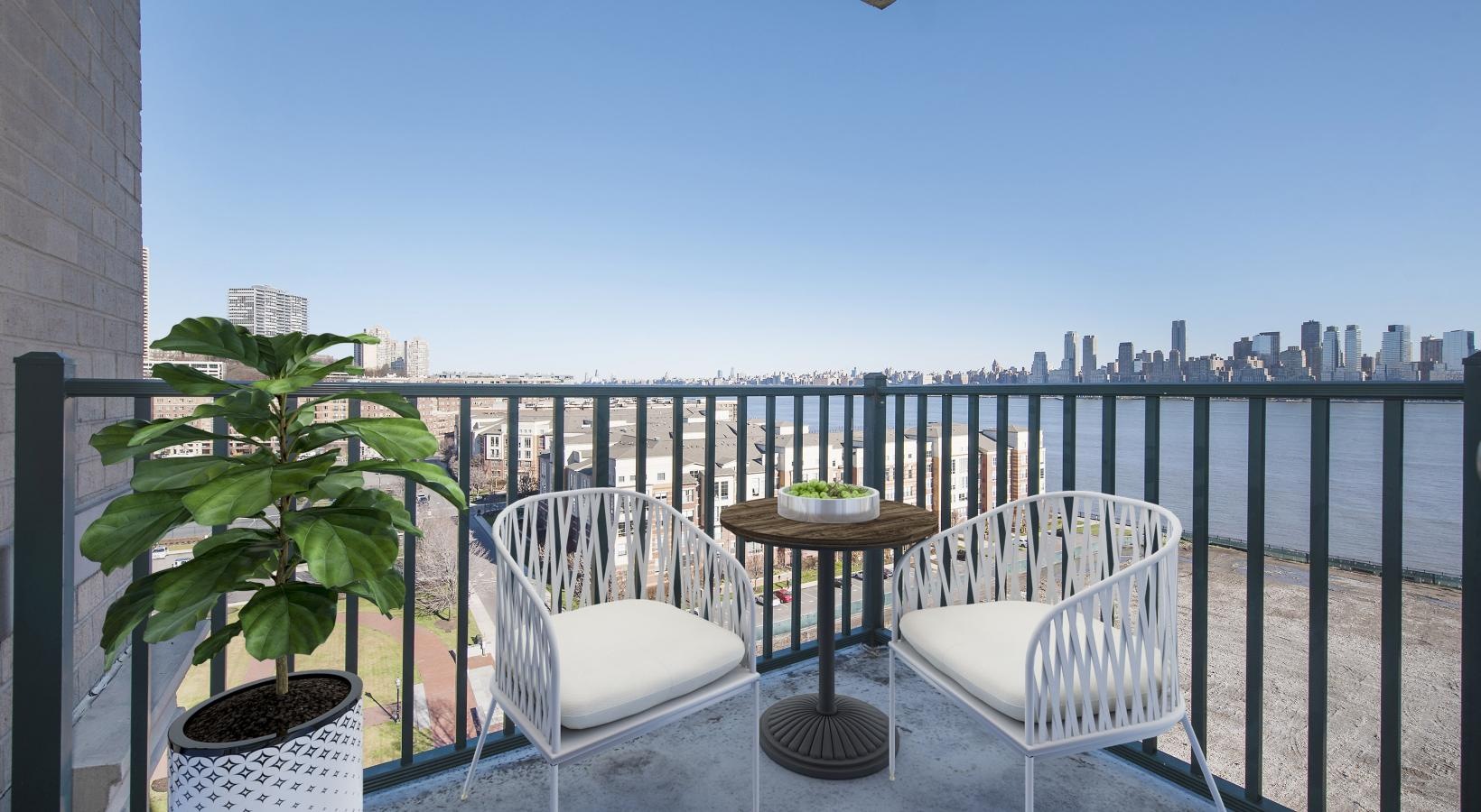 Spacious balconies a table and chairs on a deck