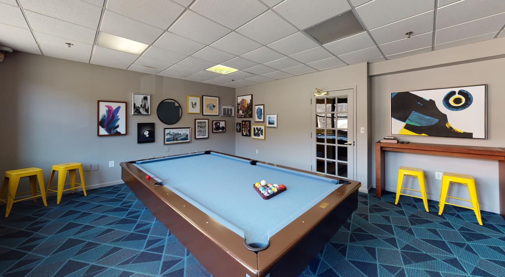 Access to resident-only features a pool table in a room