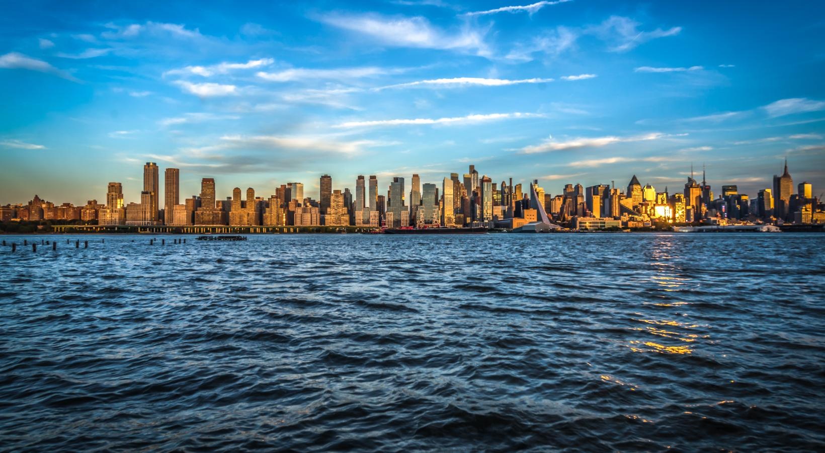 A beautiful community at the heart of all your passions a city skyline across the water