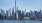 a city skyline with a body of water in the foreground