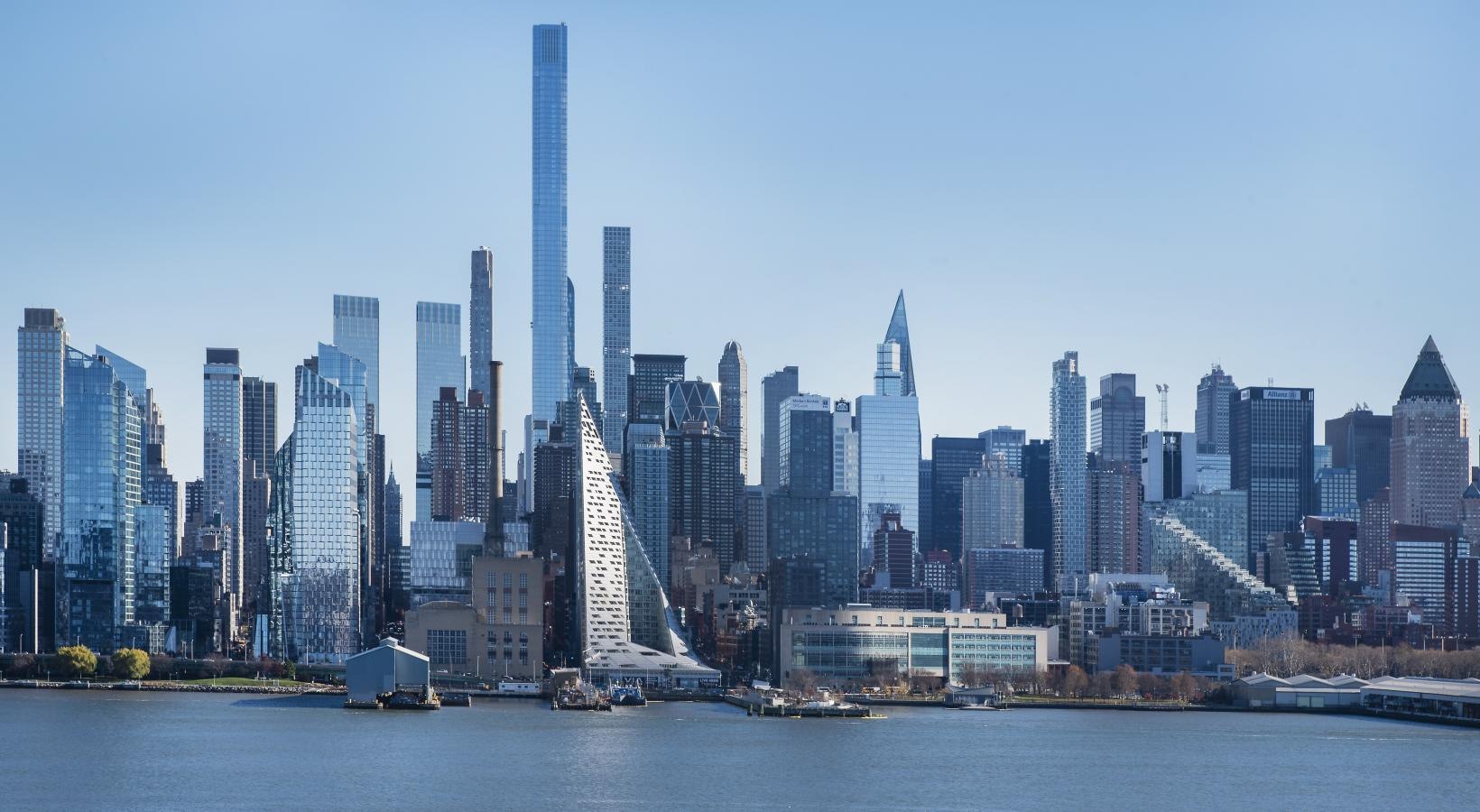 Find your perfect fit at Riverbend at Port Imperial a city skyline with a body of water in the foreground