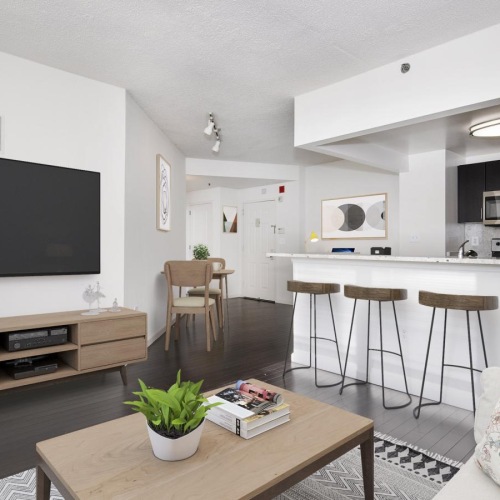 a living room with a tv and a table